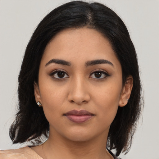 Neutral latino young-adult female with medium  black hair and brown eyes