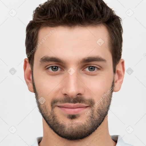 Joyful white young-adult male with short  brown hair and brown eyes