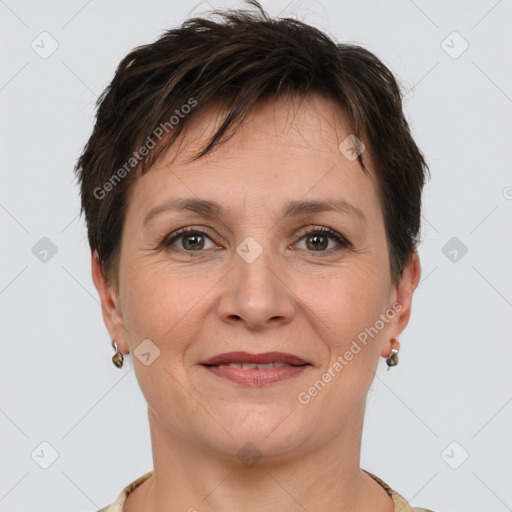 Joyful white adult female with short  brown hair and brown eyes