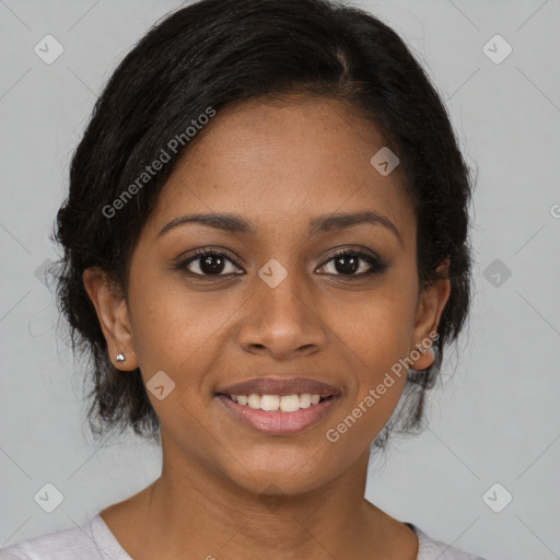 Joyful black young-adult female with medium  brown hair and brown eyes