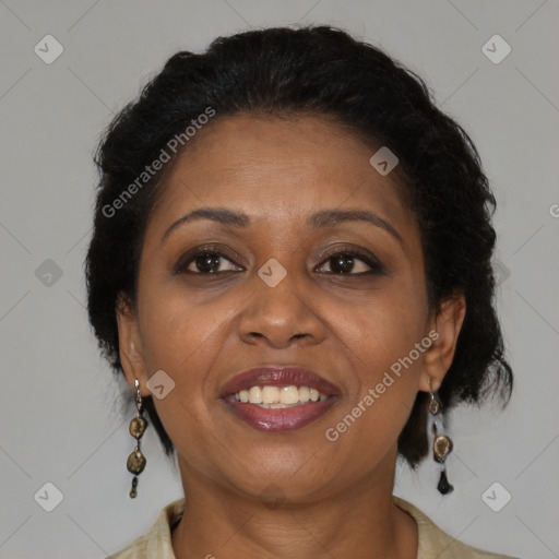 Joyful black adult female with medium  brown hair and brown eyes