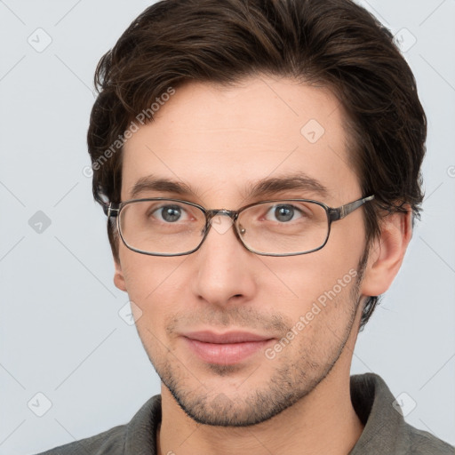 Neutral white young-adult male with short  brown hair and grey eyes