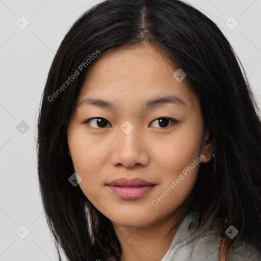 Joyful asian young-adult female with long  brown hair and brown eyes