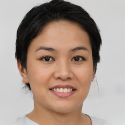 Joyful asian young-adult female with short  brown hair and brown eyes