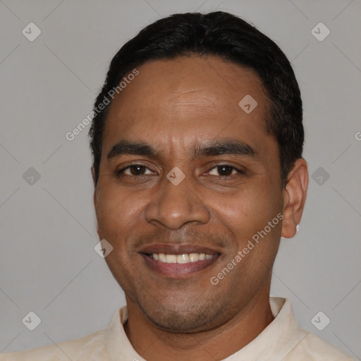 Joyful latino young-adult male with short  black hair and brown eyes