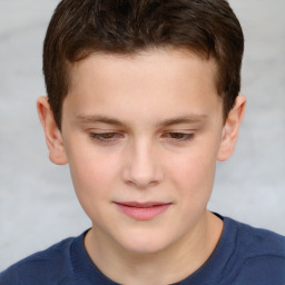 Joyful white child male with short  brown hair and brown eyes