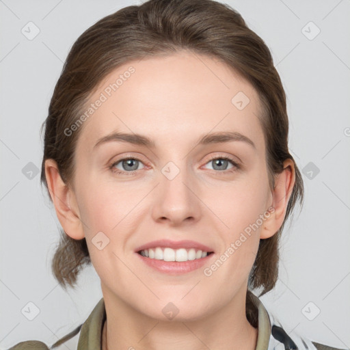 Joyful white young-adult female with medium  brown hair and grey eyes