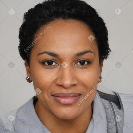 Joyful black adult female with short  brown hair and brown eyes