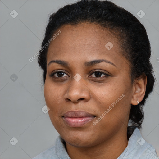 Joyful black young-adult female with medium  brown hair and brown eyes