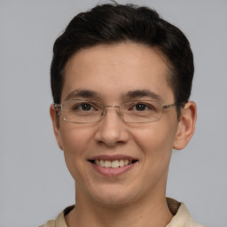 Joyful white adult male with short  brown hair and grey eyes