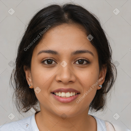 Joyful latino young-adult female with medium  brown hair and brown eyes