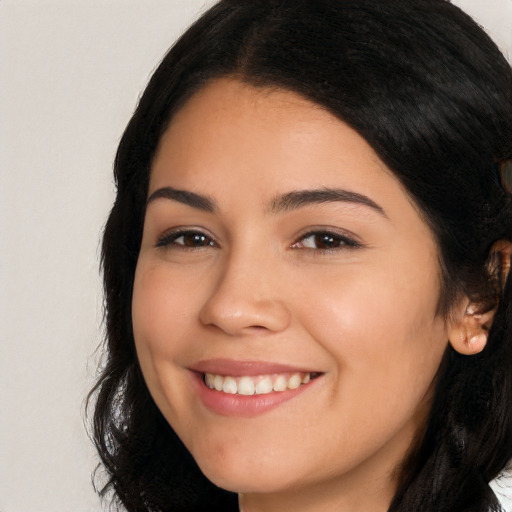 Joyful white young-adult female with long  brown hair and brown eyes