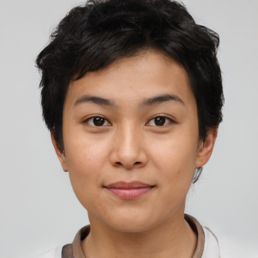 Joyful asian young-adult female with short  black hair and brown eyes