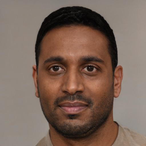 Neutral black young-adult male with short  black hair and brown eyes