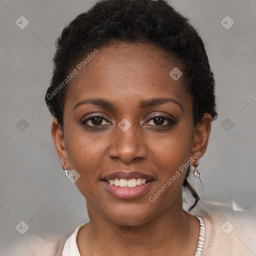 Joyful black young-adult female with short  brown hair and brown eyes