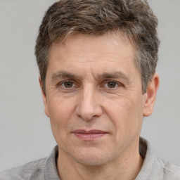 Joyful white adult male with short  brown hair and grey eyes