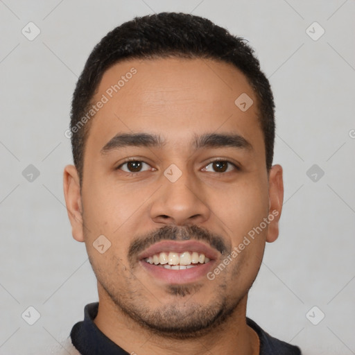 Joyful latino young-adult male with short  black hair and brown eyes