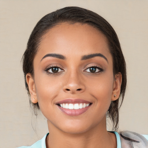 Joyful white young-adult female with medium  brown hair and brown eyes