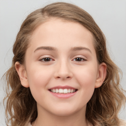 Joyful white child female with medium  brown hair and grey eyes