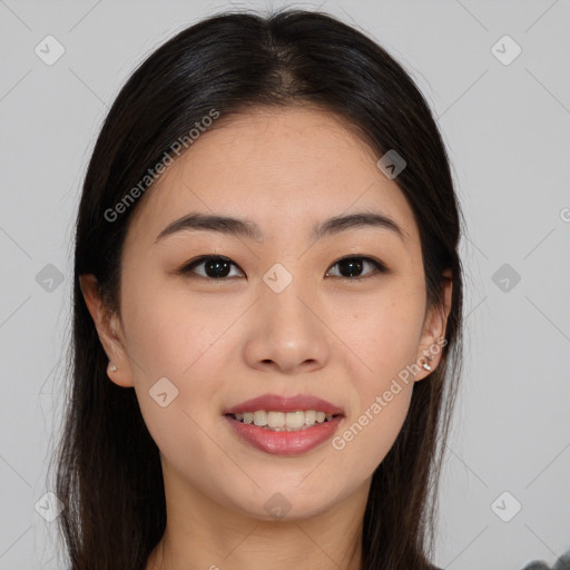 Joyful asian young-adult female with long  brown hair and brown eyes