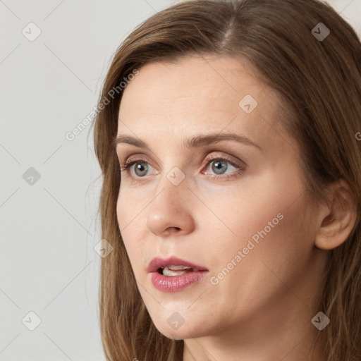 Neutral white young-adult female with long  brown hair and grey eyes