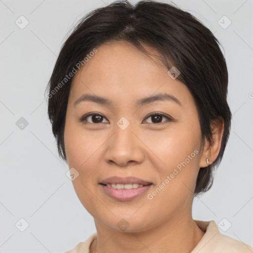 Joyful asian young-adult female with medium  brown hair and brown eyes