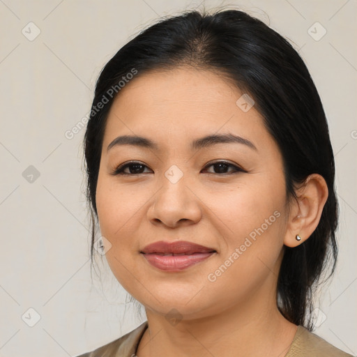 Joyful asian young-adult female with medium  brown hair and brown eyes