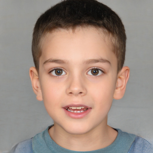 Joyful white child male with short  brown hair and brown eyes