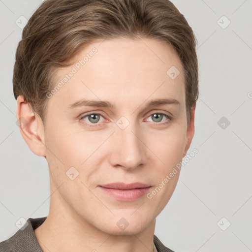 Joyful white young-adult female with short  brown hair and grey eyes