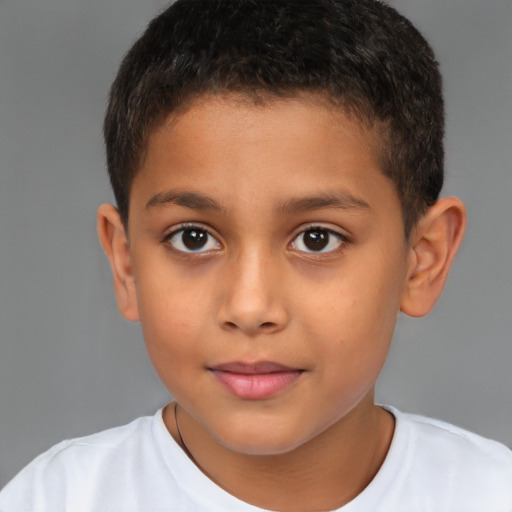 Joyful latino child male with short  brown hair and brown eyes