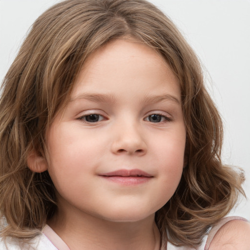 Joyful white child female with medium  brown hair and brown eyes