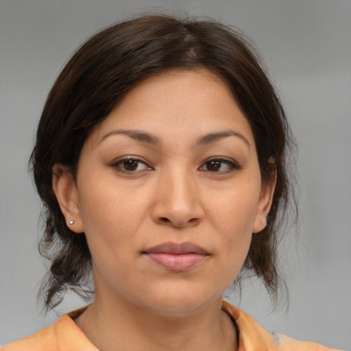 Joyful asian young-adult female with medium  brown hair and brown eyes