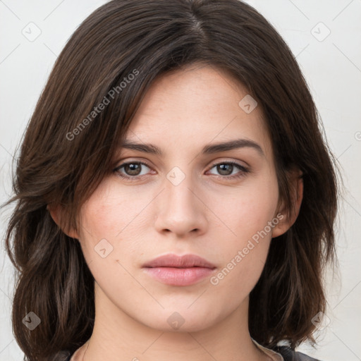 Neutral white young-adult female with medium  brown hair and brown eyes