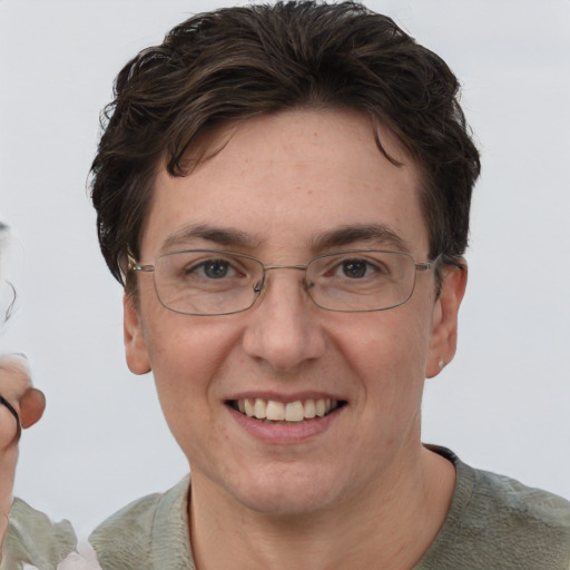 Joyful white adult female with short  brown hair and brown eyes