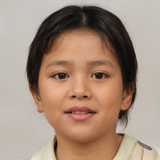 Joyful asian child female with medium  brown hair and brown eyes
