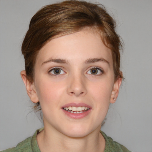 Joyful white young-adult female with medium  brown hair and blue eyes