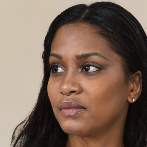 Neutral black young-adult female with long  black hair and brown eyes