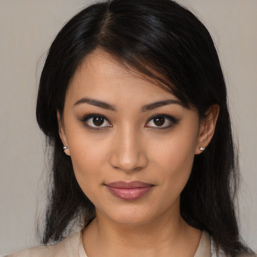 Joyful latino young-adult female with medium  black hair and brown eyes