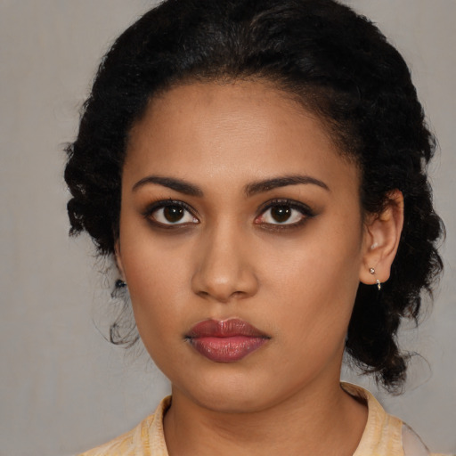 Neutral latino young-adult female with medium  black hair and brown eyes