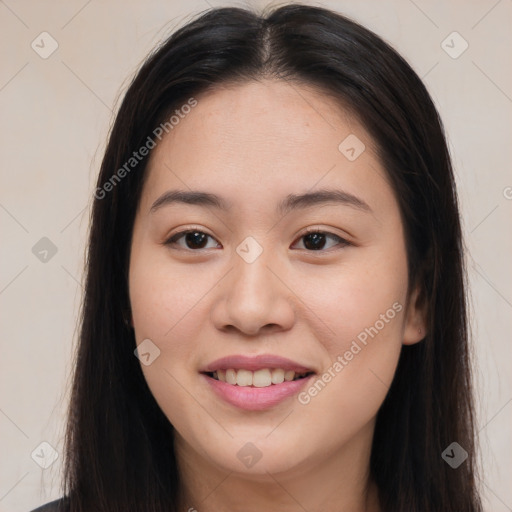 Joyful asian young-adult female with long  brown hair and brown eyes