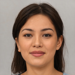 Joyful asian young-adult female with medium  brown hair and brown eyes