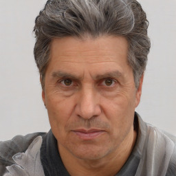 Joyful white middle-aged male with short  brown hair and brown eyes