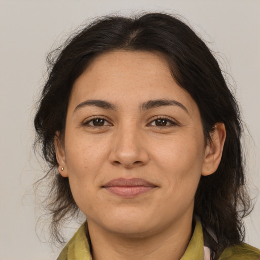 Joyful asian adult female with medium  brown hair and brown eyes