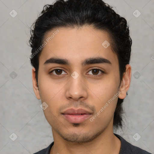 Neutral latino young-adult male with short  black hair and brown eyes