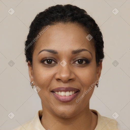 Joyful black young-adult female with short  brown hair and brown eyes