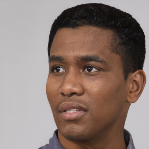 Neutral black young-adult male with short  black hair and brown eyes