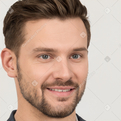 Joyful white young-adult male with short  brown hair and grey eyes