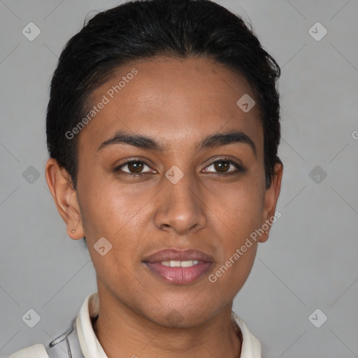 Joyful latino young-adult female with short  brown hair and brown eyes