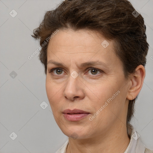 Joyful white adult female with short  brown hair and brown eyes