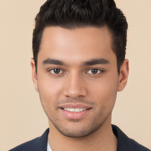 Joyful white young-adult male with short  black hair and brown eyes